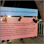 [thumbnail of One side of the two-sided collective sandwich board]